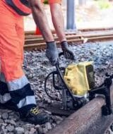Cembre LD-16B-RPT battery rail drill on railway track