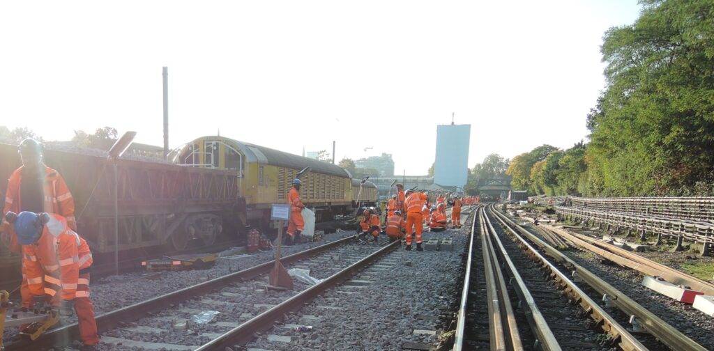 Railway maintenance crew working along railway tracks