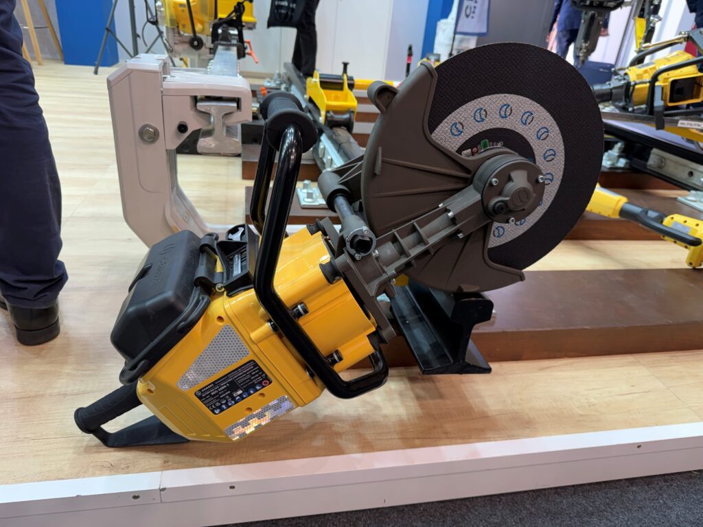 Cembre RDS-36BN-S battery rail saw on display with its cutting disc, guard and rail support arm