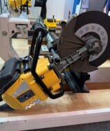 Cembre RDS-36BN-S battery rail saw on display with its cutting disc, guard and rail support arm