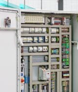Phoenix Contact control cabinet with an engineer beside the open cabinet